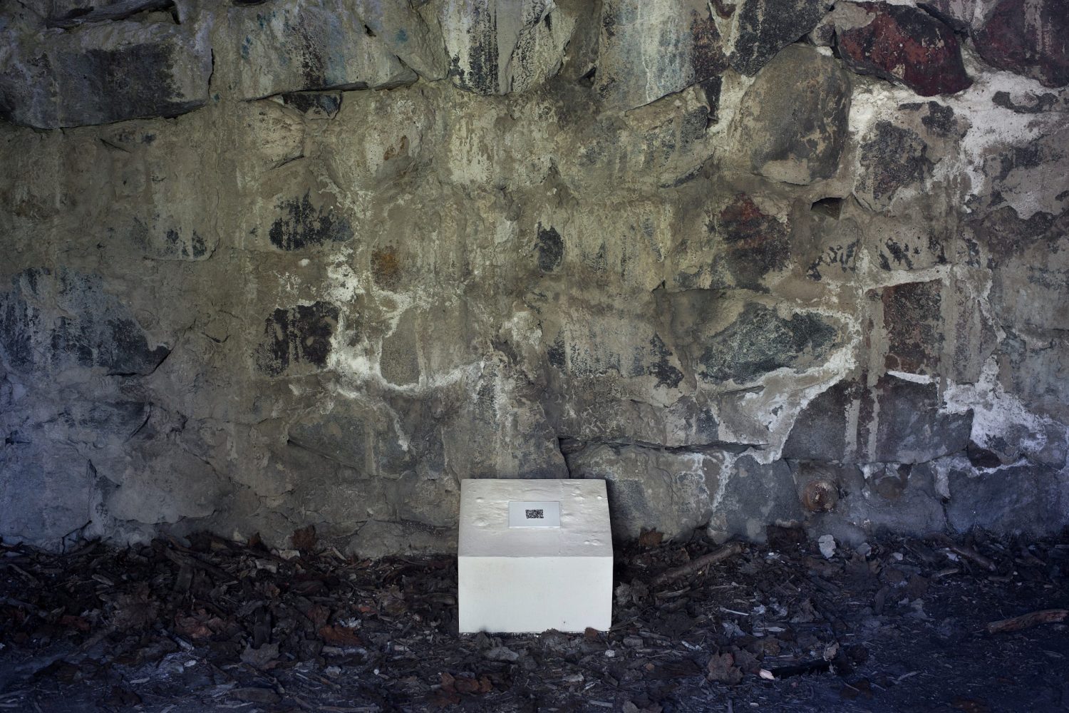 (Work in the bunker) | plaster, aluminium, QR- code | H:22/16 X W:30 X D:30 cm | Photo: Sandra Kantanen